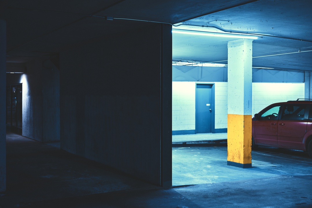 Underground parking garage in blue and yellow light — Calgary urban photography